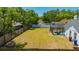 The fully fenced backyard includes a fire pit and a screened-in pool area at 18238 Clear Lake Dr, Lutz, FL 33548