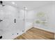 This bathroom showcases a glass shower, soaking tub, and charming window with natural light at 18238 Clear Lake Dr, Lutz, FL 33548