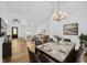 Open concept dining room with views of the entryway and living room at 18238 Clear Lake Dr, Lutz, FL 33548