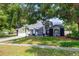 Charming two-story home with well-maintained landscaping and a spacious driveway at 18238 Clear Lake Dr, Lutz, FL 33548