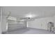 Spacious two car garage with an automatic door opener and access door to inside at 18238 Clear Lake Dr, Lutz, FL 33548