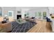 Open living room showcasing a decorative rug, modern furnishings, and a fireplace for comfortable living at 18238 Clear Lake Dr, Lutz, FL 33548
