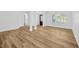 Bright and airy living room featuring laminate wood floors and white walls at 18238 Clear Lake Dr, Lutz, FL 33548