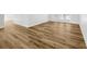 Laminate wood flooring extends to the patio doors of this living space at 18238 Clear Lake Dr, Lutz, FL 33548