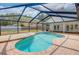 Screened in pool with brick deck is perfect for entertaining and enjoying outdoors at 18238 Clear Lake Dr, Lutz, FL 33548
