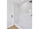 Bright shower with white marble tile and a modern fixture at 18238 Clear Lake Dr, Lutz, FL 33548
