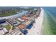 Aerial view of condos on the beach with a tennis court and lovely water views at 19417 Gulf Blvd # E217, Indian Shores, FL 33785