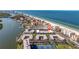 Wonderful aerial view of condos on the beach with boat docks and community pool at 19417 Gulf Blvd # E217, Indian Shores, FL 33785