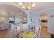 Open-concept dining area flows into the kitchen and living space, with a table, seating, and charming decor at 19417 Gulf Blvd # E217, Indian Shores, FL 33785