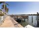 Waterfront dock with boat slip, offering direct access to the bay at 19417 Gulf Blvd # E217, Indian Shores, FL 33785