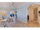Inviting living room with tile flooring, ceiling fan, neutral paint and convenient access to the bathroom and enclosed patio at 19417 Gulf Blvd # E217, Indian Shores, FL 33785