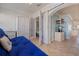 Cozy enclosed patio with a futon, wardrobe and access to the main bedroom at 19417 Gulf Blvd # E217, Indian Shores, FL 33785