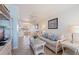 An inviting living room flows into the dining area, featuring a comfortable sofa, stylish decor, and a relaxed vibe at 19417 Gulf Blvd # E217, Indian Shores, FL 33785