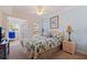 Inviting main bedroom with ceiling fan, natural light, patio access, and stylish decor at 19417 Gulf Blvd # E217, Indian Shores, FL 33785