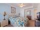 Bright main bedroom with ceiling fan, accent wall, natural light and stylish decor at 19417 Gulf Blvd # E217, Indian Shores, FL 33785