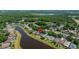 Scenic aerial of the home and neighborhood in a treed area near the lake at 19505 Morden Blush Dr, Lutz, FL 33558