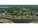 Long scenic aerial view of the home along the lake at 19505 Morden Blush Dr, Lutz, FL 33558