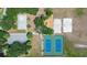 Overhead view of neighborhood park featuring basketball court, playground, and tennis and volleyball courts at 19505 Morden Blush Dr, Lutz, FL 33558