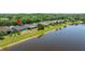Scenic aerial of the house and neighborhood near the water at 19505 Morden Blush Dr, Lutz, FL 33558