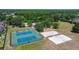 Community park aerial featuring tennis, playground, and volleyball courts and surrounding trees at 19505 Morden Blush Dr, Lutz, FL 33558