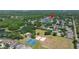Community aerial view featuring multiple ponds, park, tennis, volleyball, and basketball courts at 19505 Morden Blush Dr, Lutz, FL 33558