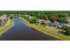 Scenic aerial view of a home next to the water at 19505 Morden Blush Dr, Lutz, FL 33558