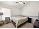 Cozy bedroom featuring neutral carpet, ceiling fan, and window with blinds at 19505 Morden Blush Dr, Lutz, FL 33558