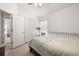 Bright bedroom with double door closet, and window providing natural light at 19505 Morden Blush Dr, Lutz, FL 33558