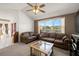 Comfortable living room featuring a large window with scenic lake views at 19505 Morden Blush Dr, Lutz, FL 33558