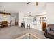 Open floor plan showcasing the living, dining, and kitchen areas for easy living at 19505 Morden Blush Dr, Lutz, FL 33558