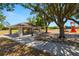 A shaded picnic area with tables offers a relaxing spot for outdoor gatherings and enjoying meals at 19505 Morden Blush Dr, Lutz, FL 33558