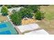 Aerial view of park featuring playground, basketball, tennis, and sand volleyball courts at 19505 Morden Blush Dr, Lutz, FL 33558