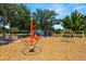 Multiple play structures offer a dynamic space for activities, enhanced by benches for relaxation at 19505 Morden Blush Dr, Lutz, FL 33558