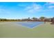 Well-maintained tennis courts with nets offer a space for residents to engage in sports and stay active at 19505 Morden Blush Dr, Lutz, FL 33558