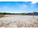 Sandy volleyball court offers a recreational space for friendly matches and outdoor fun in the community at 19505 Morden Blush Dr, Lutz, FL 33558