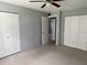 Comfortable bedroom featuring carpeted floors and ample closet space at 1975 W Bay Dr # 207, Largo, FL 33770