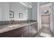 Bathroom with double sinks, granite countertops and a shower at 207 Chippewa Ave, Tampa, FL 33606