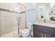 Bright bathroom with glass door shower, modern vanity and toilet at 207 Chippewa Ave, Tampa, FL 33606
