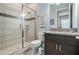 Modern bathroom featuring glass shower, granite counter tops, and tile flooring at 207 Chippewa Ave, Tampa, FL 33606