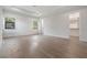 Spacious bedroom with hardwood floors and natural light streaming through the windows at 207 Chippewa Ave, Tampa, FL 33606