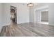 Bright dining room with wood-look flooring leading into the adjacent living spaces at 207 Chippewa Ave, Tampa, FL 33606