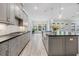 Spacious kitchen with long countertops, large center island and open to the living spaces at 207 Chippewa Ave, Tampa, FL 33606