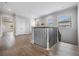 Upstairs landing features hardwood flooring and natural light from windows at 207 Chippewa Ave, Tampa, FL 33606