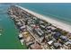 Stunning aerial view of beachfront community with turquoise waters and sandy shores at 2700 Pass A Grille Way, St Pete Beach, FL 33706