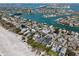 Beautiful aerial view of waterfront homes, bridge access, and stunning shoreline at 2700 Pass A Grille Way, St Pete Beach, FL 33706