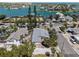 Aerial view of waterfront homes showing the home's proximity to bay access and a desirable coastal lifestyle at 2700 Pass A Grille Way, St Pete Beach, FL 33706