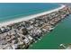 Picturesque aerial view of homes lining the waterfront with beach and bay views at 2700 Pass A Grille Way, St Pete Beach, FL 33706