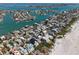 Aerial view features houses on the waterfront with docks and bay access at 2700 Pass A Grille Way, St Pete Beach, FL 33706