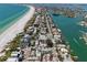 Breathtaking aerial view of the beachside community with coastline and bay access at 2700 Pass A Grille Way, St Pete Beach, FL 33706