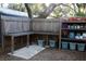 Backyard potting station with custom workspace and storage shelves for gardening supplies at 2810 Norwood Ln, Venice, FL 34292